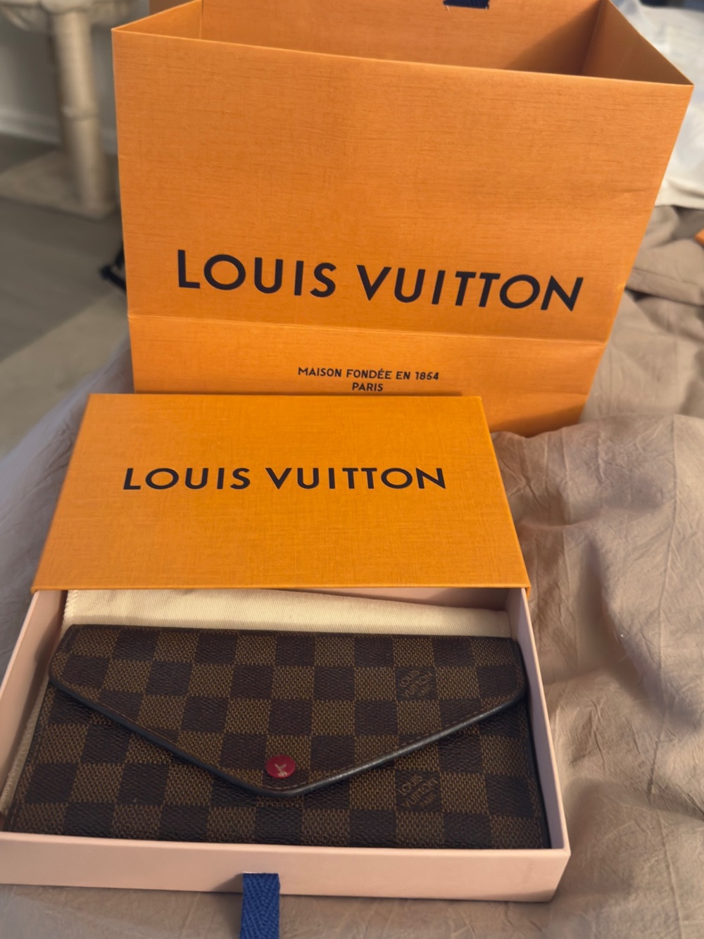 Louis Vuitton Josephine Wallet
Damier Ebene Red Lining
